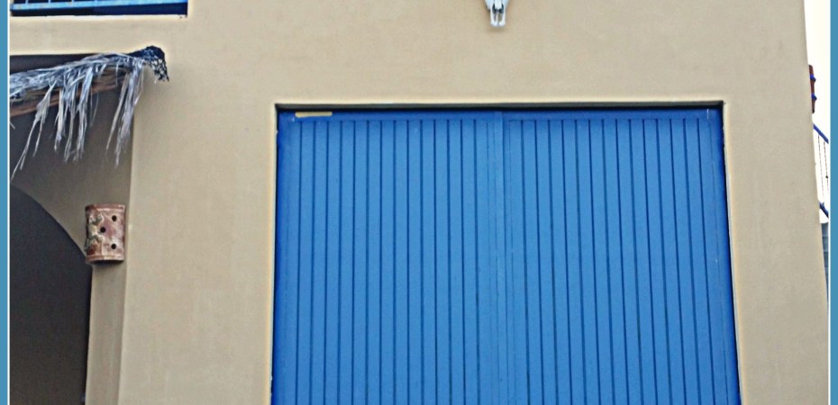 Large, blue garage door graces this fabulous retirement villa in Baja.