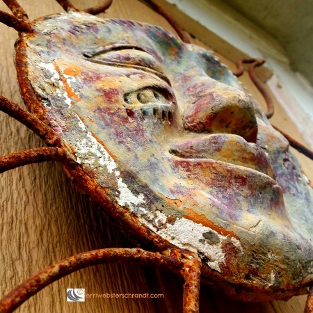 Metal Aztec sun showing a little rust