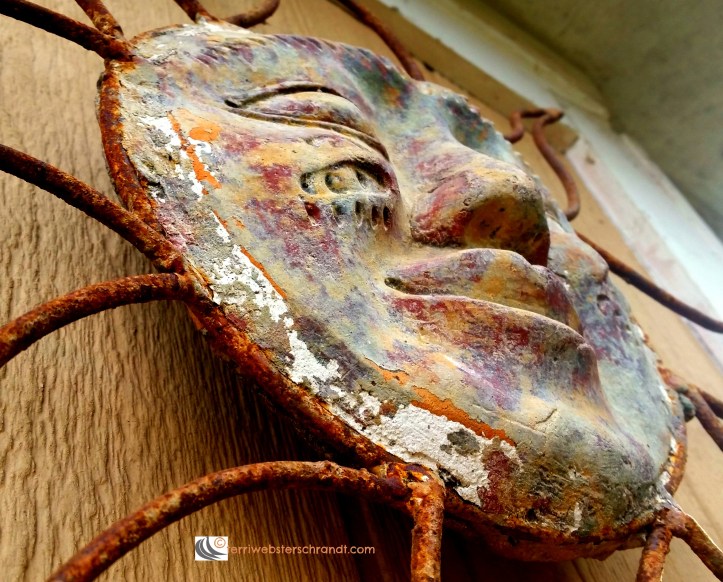 Metal Aztec sun showing a little rust