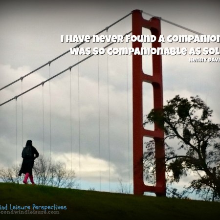 Student walks on levee from classes