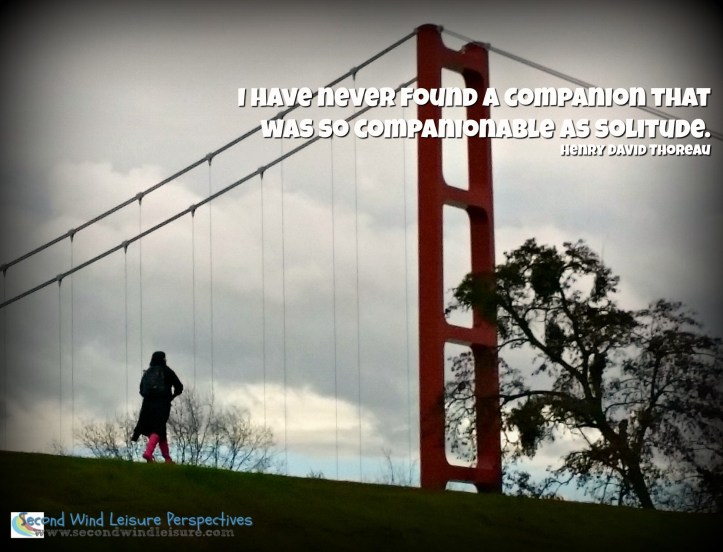 Student walks on levee from classes