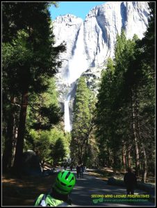 Green helmeted cyclist admires stunning view of Yosemite Falls Spring 2016
