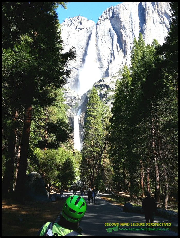 Green helmeted cyclist (my hubby) admires stunning view of Yosemite Falls Spring 2016