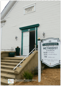 Green-framed door of this quaint, steepled church in Sutter Creek California