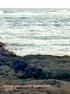ocean erodes lava rock into black sand