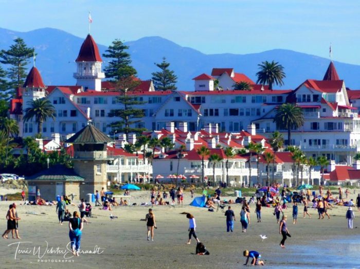 Tourists gather on the beach in Coronado