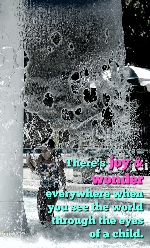Child plays in fountain