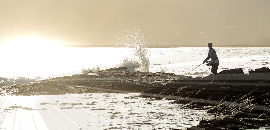 Sun sets on Hilo Bay fisherman