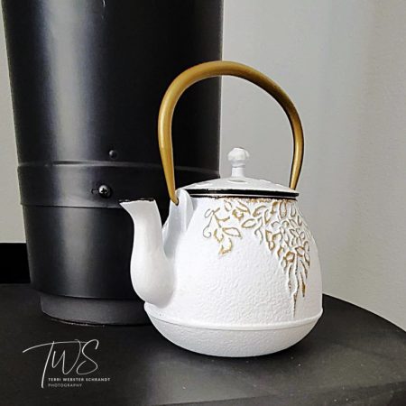 White Teapot on black stove