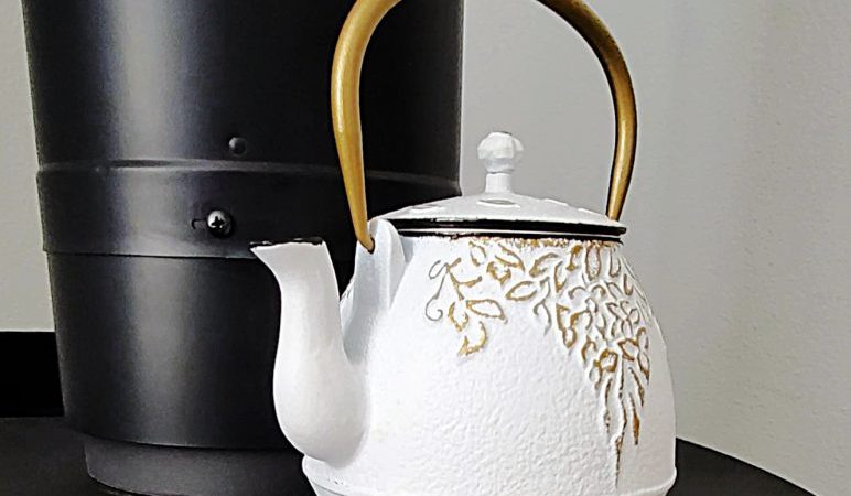 White Teapot on black stove