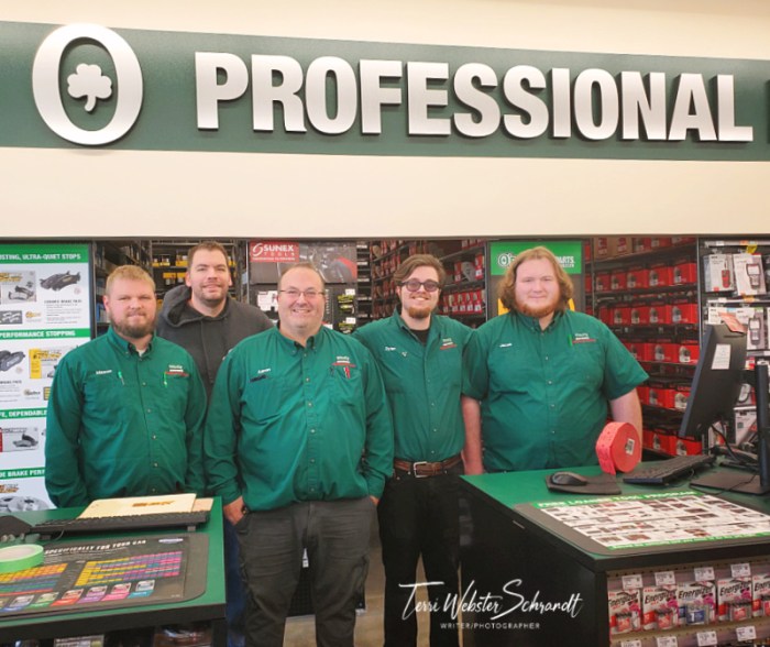 Men wearing green O'Reilly Autoparts store