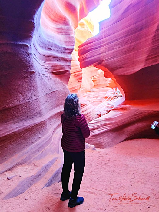 woman contemplating walls of antelope Canyon
