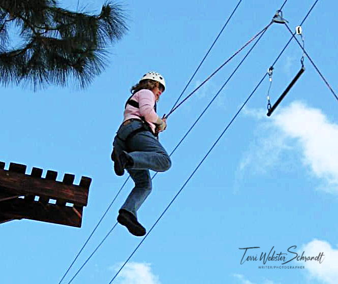 woman hanging in harness