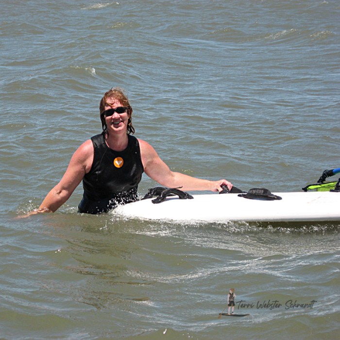 Woman with windsurf board
