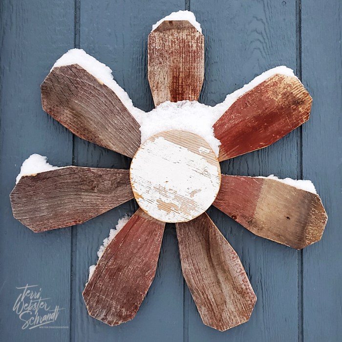 Snow-covered wooden flower