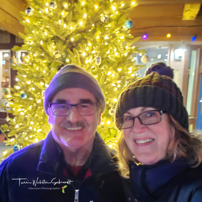 man and woman christmas tree