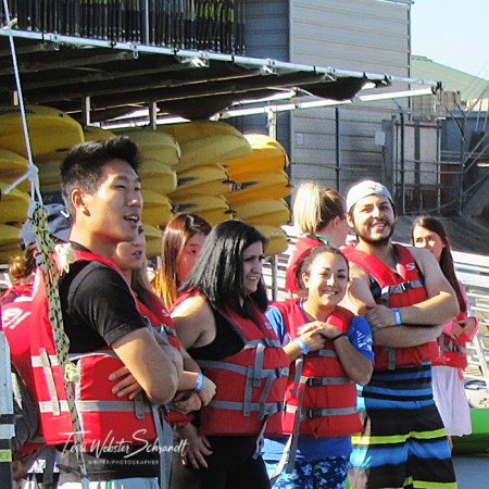 students wearing red lifevests