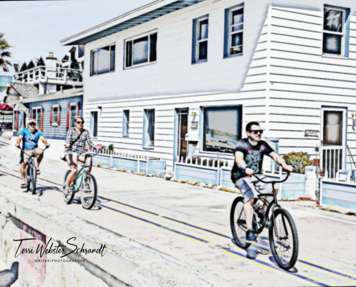 Beach boardwalk bicyclists